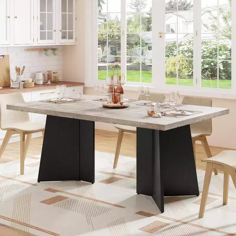 Table de salle à manger longue et moderne avec grand plateau et pieds à piédestal robustes